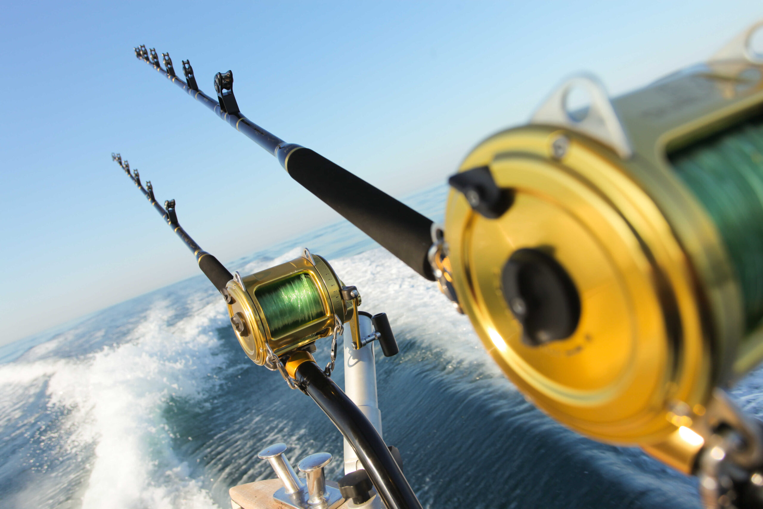 fishing reel and rod in ocean