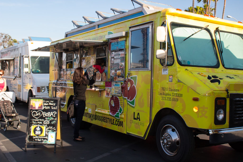 people ordering from food trucks