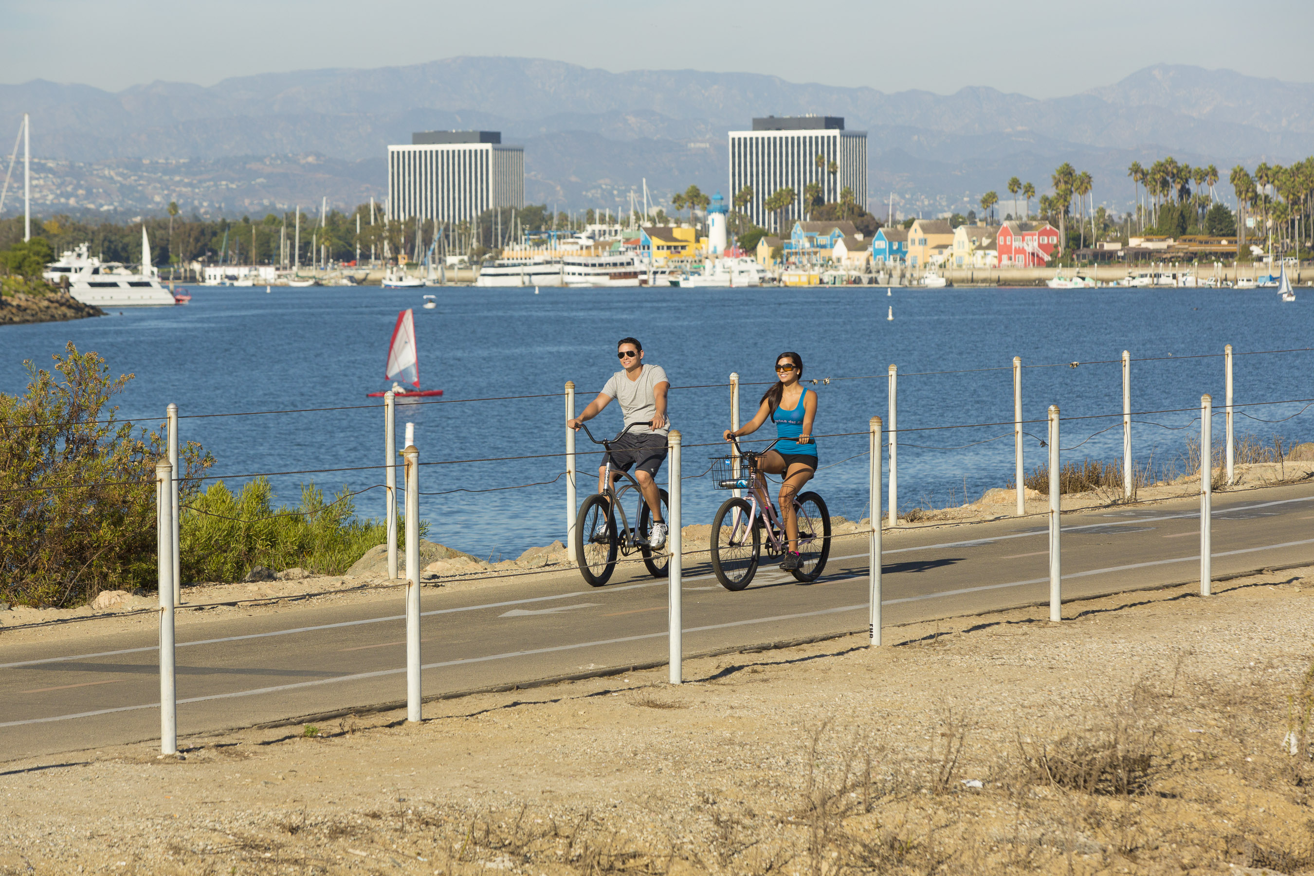 couple enjoying bike riding at the beach