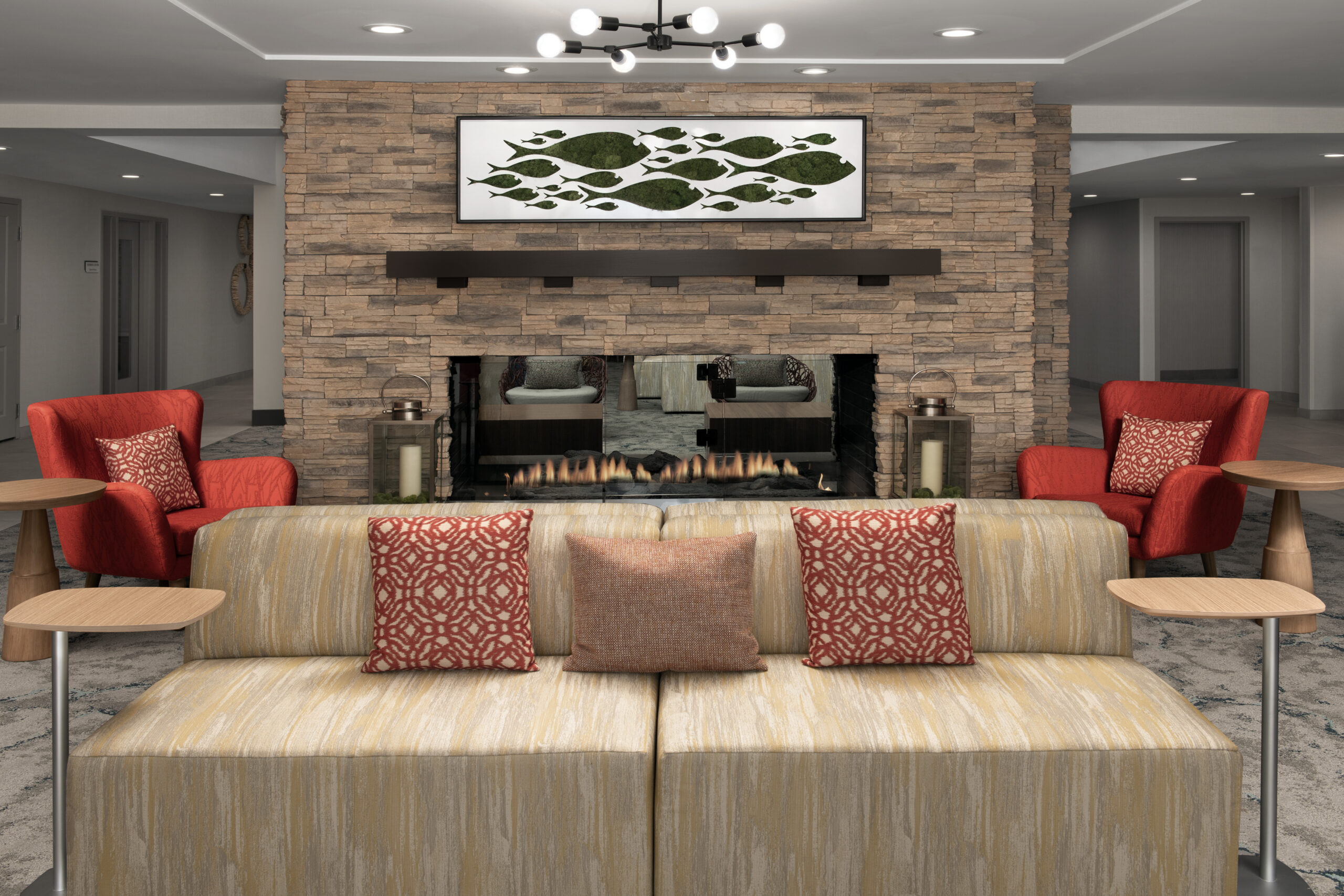 Renovated lobby with couch and fireplace