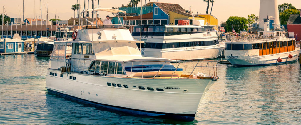 power yacht cruising through harbor