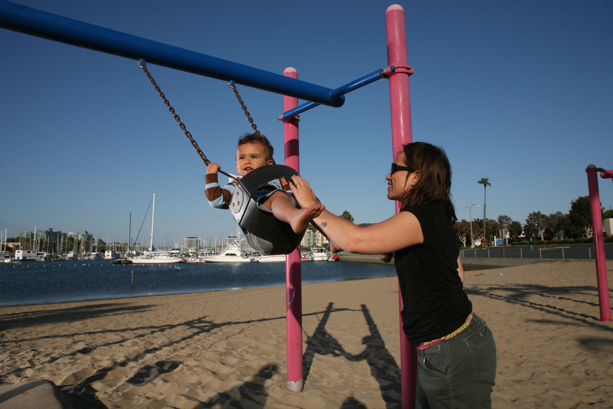 Mom playing with her child in the park