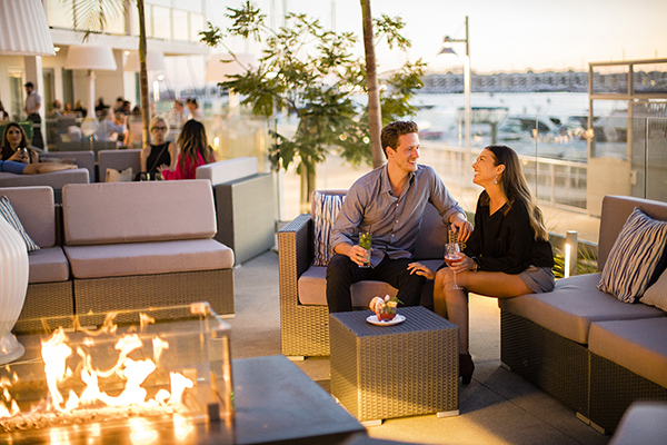 couple with cocktails at outdoor patio