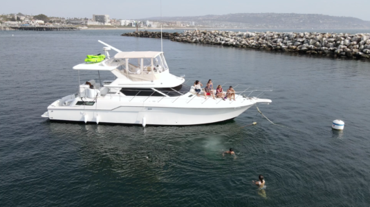 boat with people on the bow in the ocean